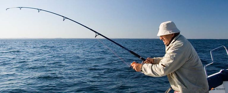 Man trrying to catch a fish